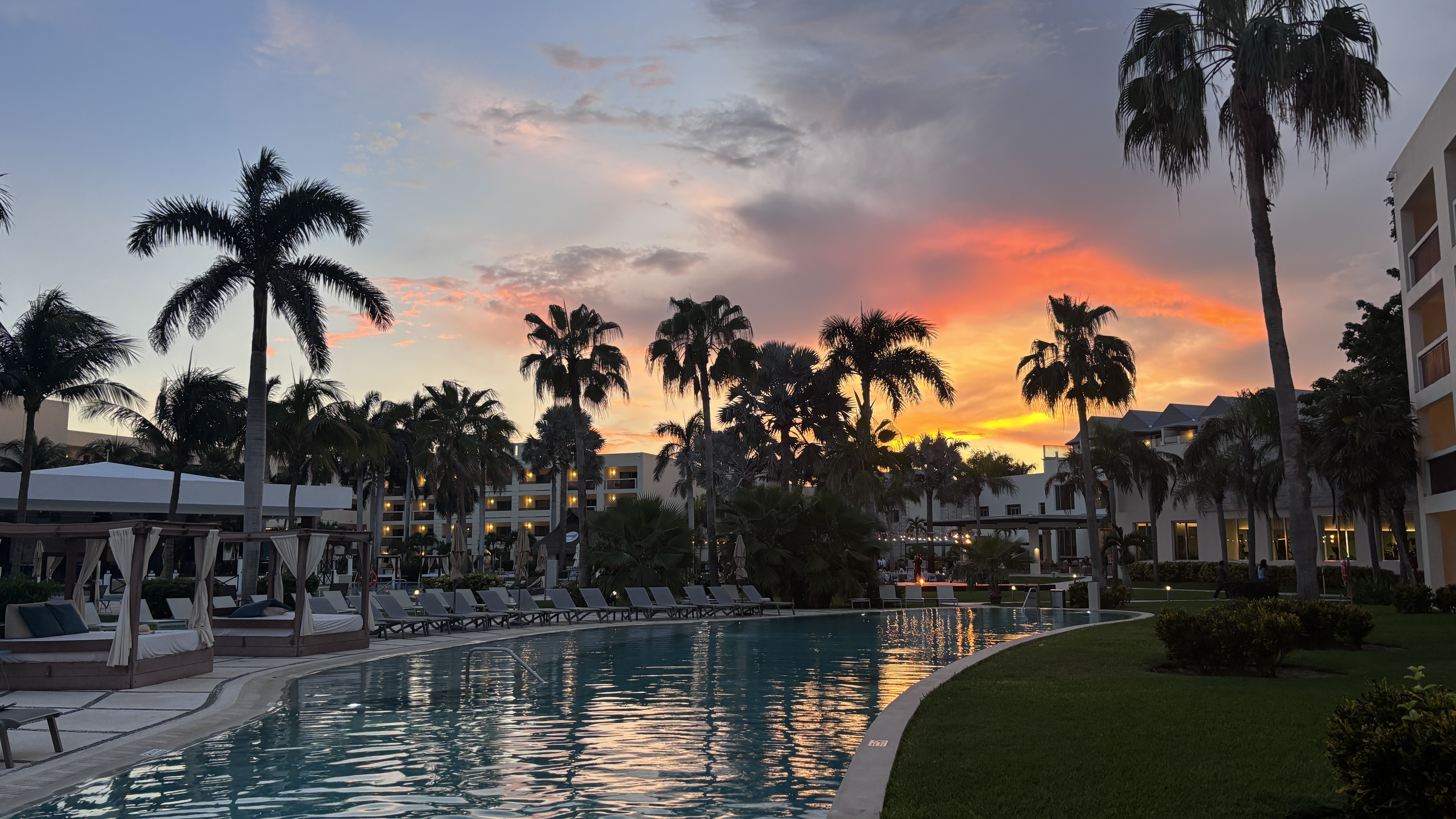 Cancun resort sunset reflected in a pool