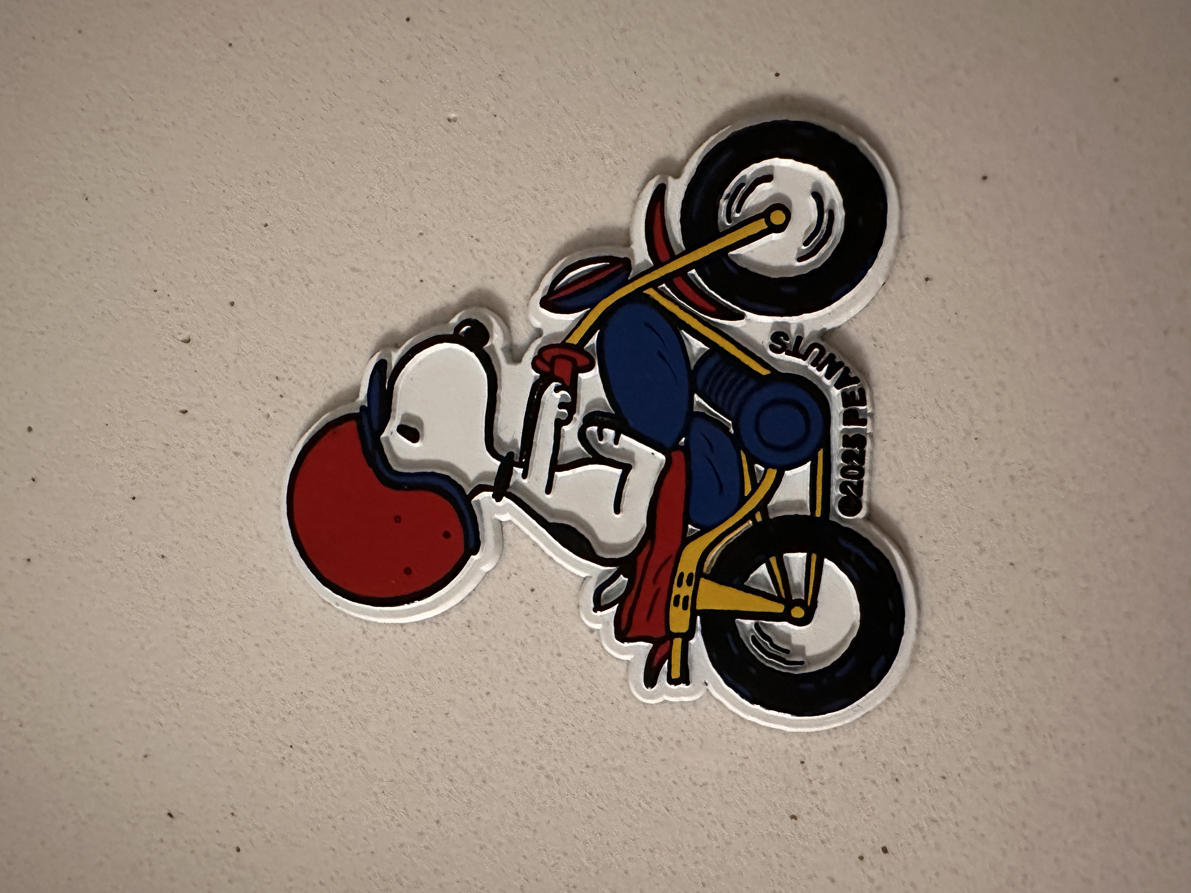 A Snoopy motorcycle magnet